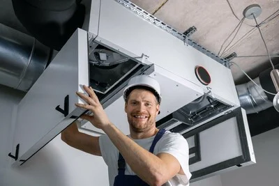 Hvac technician installing unit