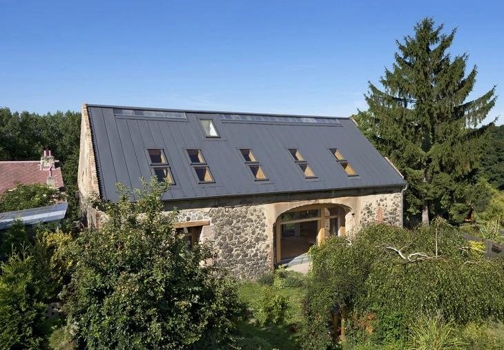 Stone house with standing seam roof