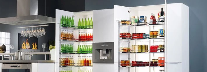 Wire kitchen storage system with open fridge doors showing o